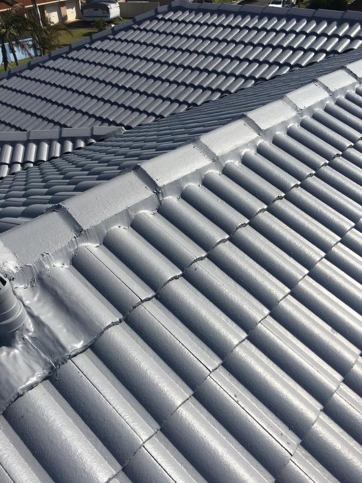 Premium restored residential roof after complete cool roof paint restoration